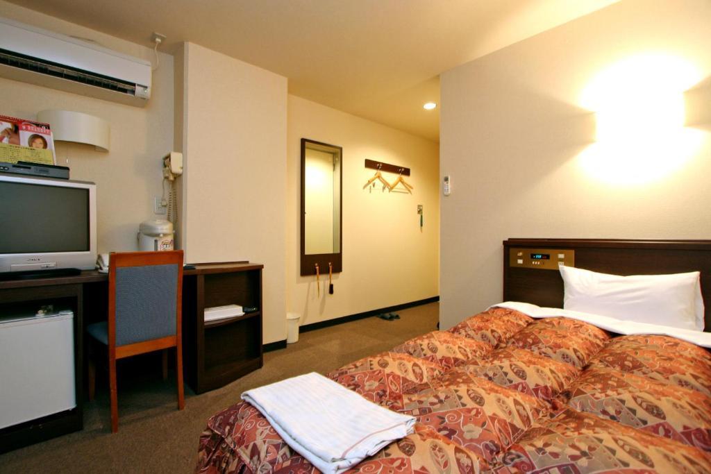 Urban Hotel Kokubu Kirishima Rum bild